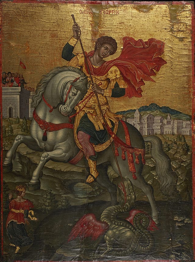 Medieval painting of a man in gold armour with a red cape on horse-back. His horse is white with red reigns. He is spearing a green dragon with red wings situated towards the bottom right of the painting. Behind the mam is a cliff face on top of which are stone buildings. The sky is composed of gold leaf.
