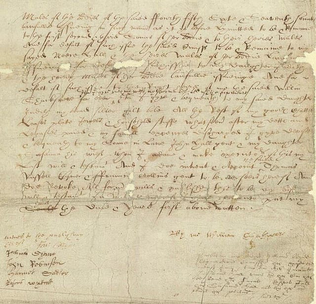 Old, discoloured document with lines of text in cursive handwriting.
