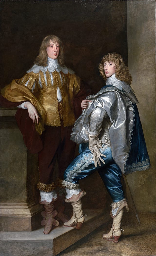Painting of two young men. Both are wearing elaborate silk clothing with large, white, lace collars. The man on the left is wearing a gold shirt with maroon pants and the man on the right is wearing a grey and blue cape with blue pants. They both have long wavy hair.