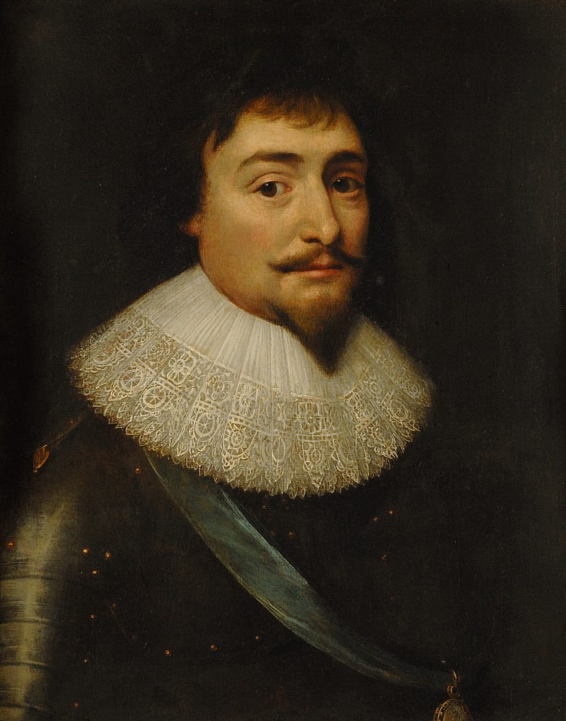 Painting of the bust of a middle-aged man against a dark background. He is wearing armour over which there is a light blue sash. He has a large, white, frilly collar, dark short hair and a goatee.
