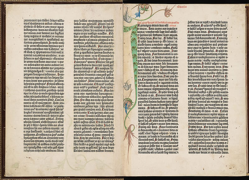 Double page spread from an old book. Each page has two columns of printed text. On the second page, a hand-drawn floral design is wrapped around the first column of text.